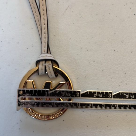 Michael Kors hang tag, gold with ivory leather strap. Approx 6” x 1.75” - Picture 4 of 5